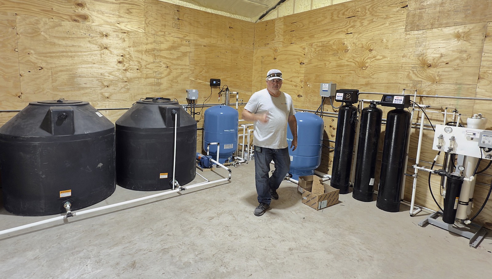 Kevin Alford in a multi-tank water treatment installation.